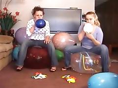 2 Girls Popping Balloons