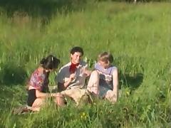 Mature ladies utterly devour his dick in a grassy field