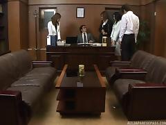 Multiple Asian women work to please their boss in his office