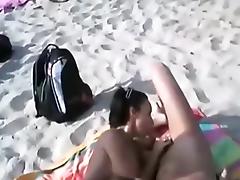 Voyeur tapes many nudists having oral sex at the beach