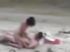 Voyeur tapes a nudist girl riding her bf at the beach