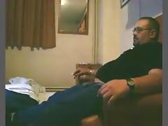 Dude smokes a cig, while his bbw wife sucks and rides him on the sofa.