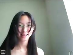Nerdy glassed asian girl masturbates her shaved pink pussy with a vibrator