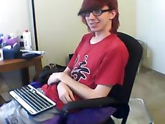 Charming fagot is playing in a small room and filming himself on computer webcam