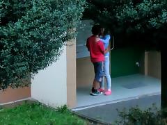 Beautiful college girl college girl  couple kissing cuddling and caressing outside