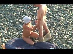 Voyeur on public beach. Oral sex