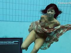 Russian teen diving while showing off her natural tits