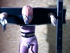 Gimp girl locked in box and pillory