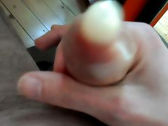 Golden Condom wank and big cumshot with pink bra