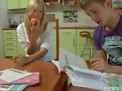 Teen cutie do her homework with her classmate