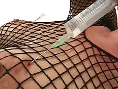 Christine gives saline injections to herself