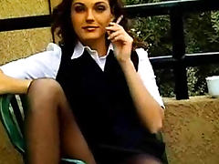 Smoking outdoors in skirt and pantyhose