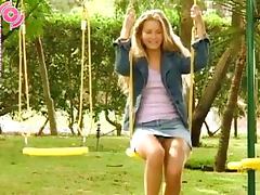 Blonde Girl Peeing While She's On The Swings