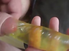 Cum into waterfilled condom under foreskin