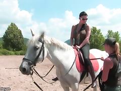 Brunette hottie Aletta Ocean rides a horse on a race course
