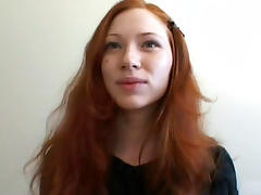 Slim redhead babe Millena demonstrates her puss