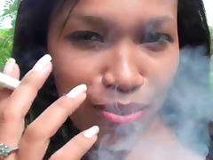 Ebony is smoking a cigarette