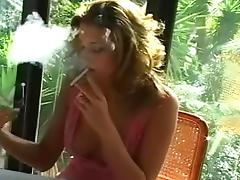 Sensual blonde is smoking a cigarette so sexy