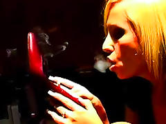 Sensual blonde is smoking a cigarette so sexy