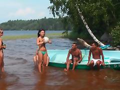 Three chicks are getting wet in the sea