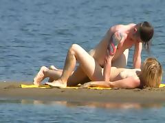 Tattooed fucker is drilling babe on the beach