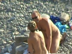 Day at the beach for nude couple
