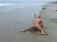 Brunette fucking on the beach