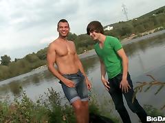 A twink and his well-built BF enjoy having sex by the pond